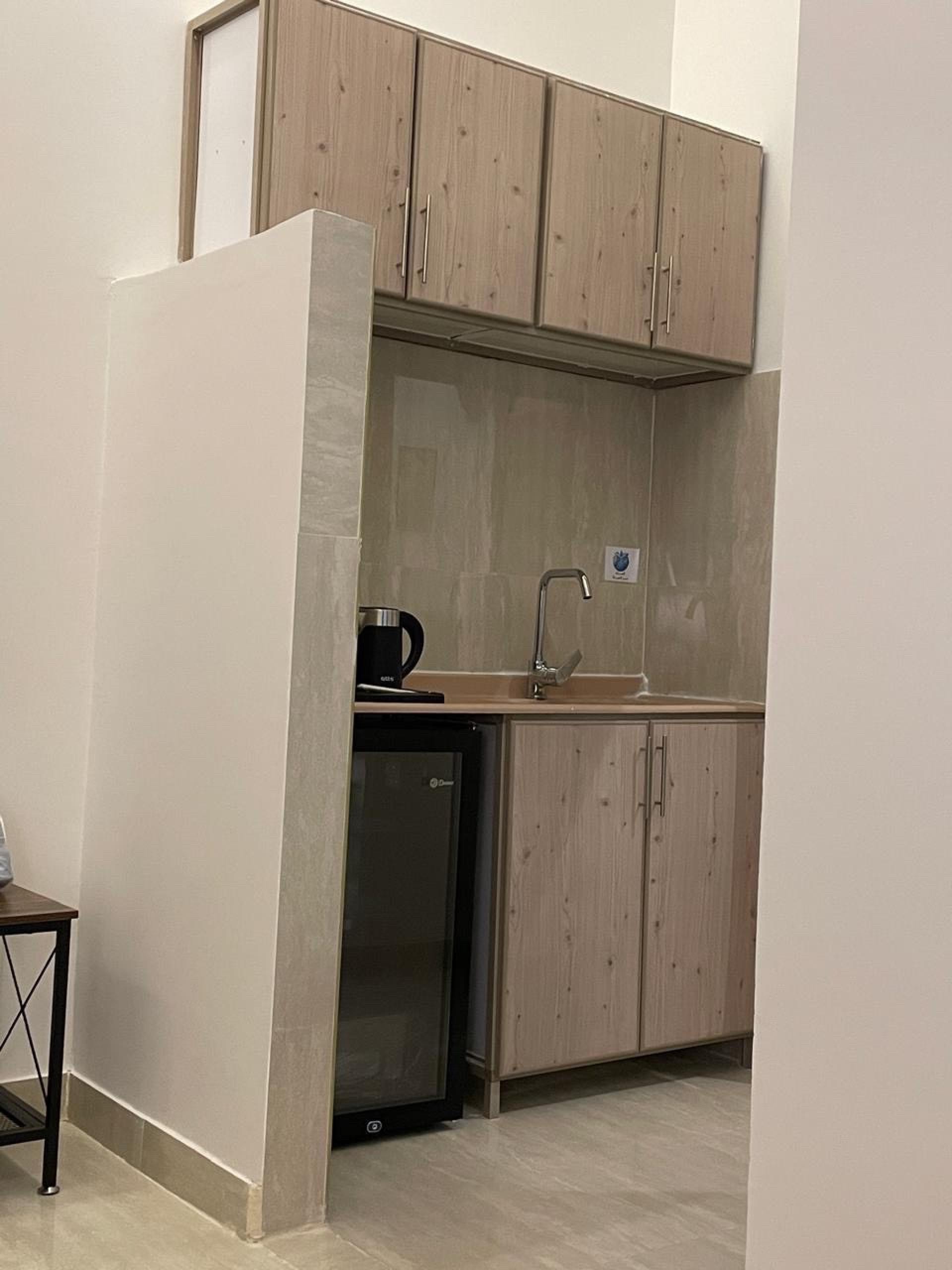 شقة بغرفة نوم وصالة دخول ذكي 7