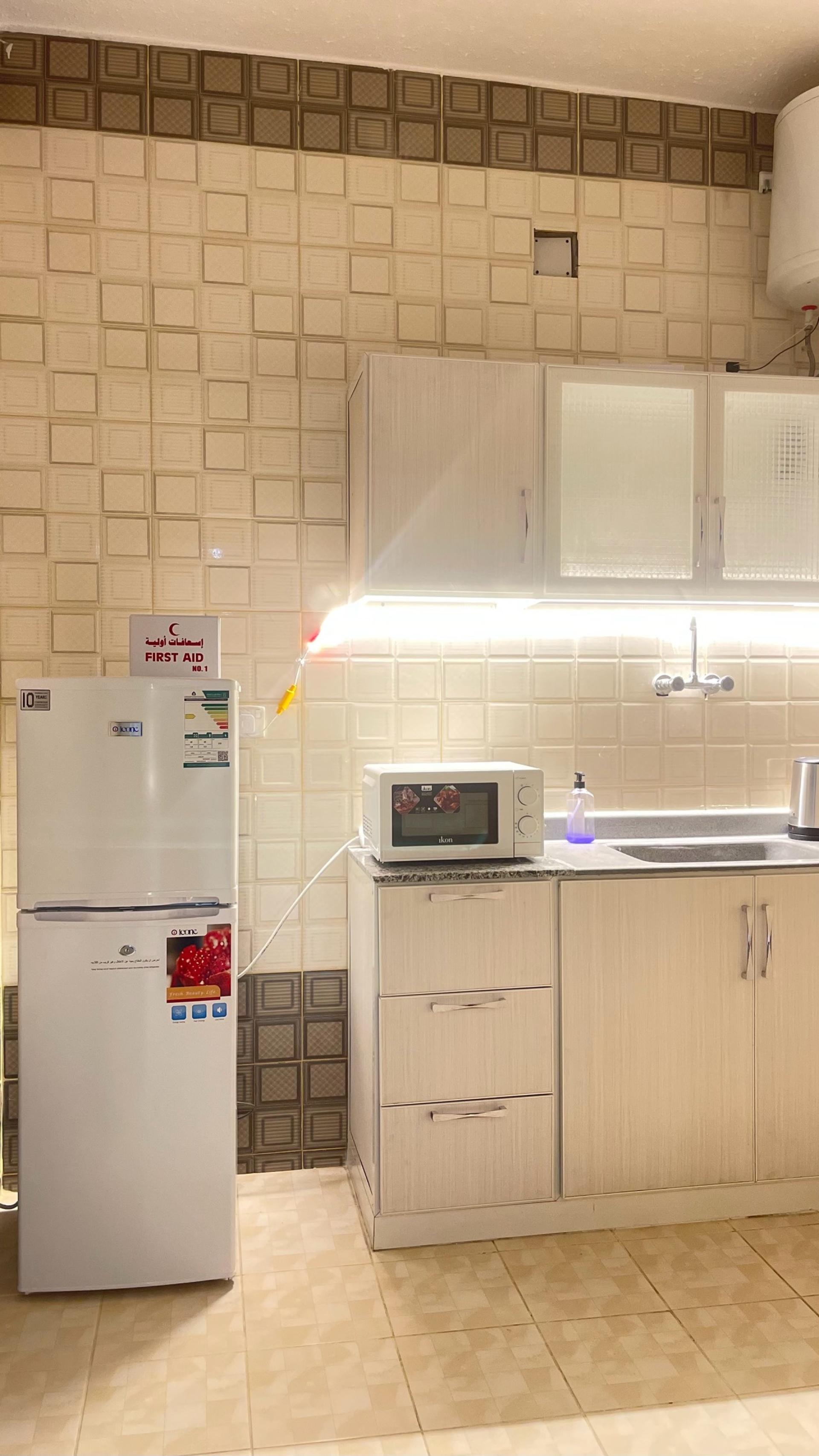 شقة أنيقة بغرفة نوم وصاله ومطبخ 11