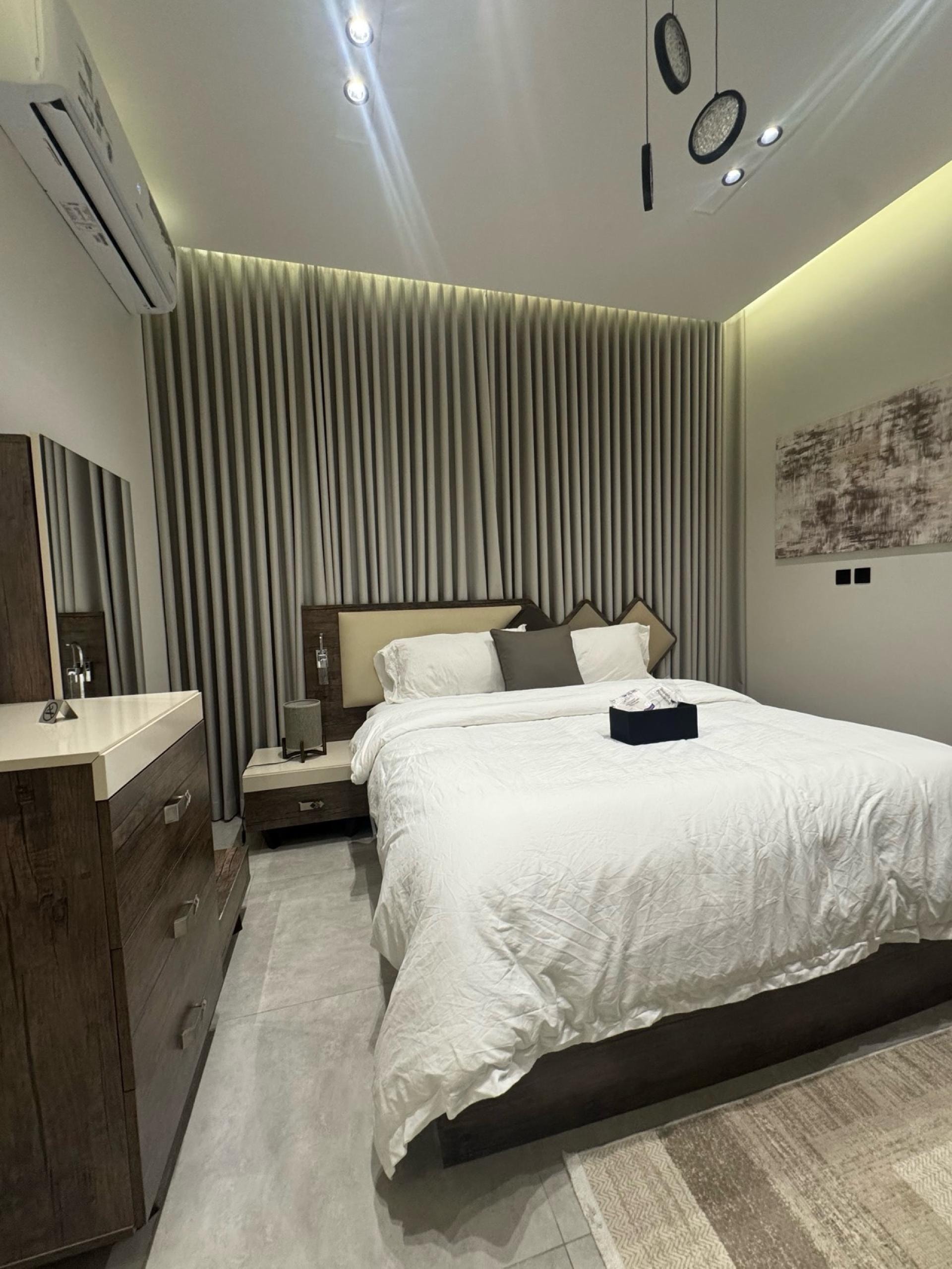 شقة فندقية بغرفة نوم وصالة دخول ذاتي 1